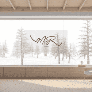 Modern room with winter landscape view, accent chair, and the logo "MPR Design." Portfolio showcase.