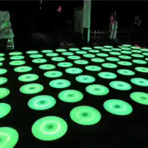 LED interactive floor with glowing circular tiles for dynamic dance and game experiences.