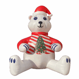 Inflatable polar bear wearing a Santa hat and Christmas sweater with a decorated tree on its chest.