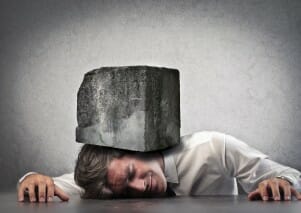 Man with a heavy stone on his head