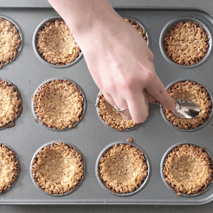 Push the bottoms of the flapjacks down using a teaspoon