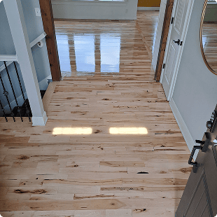 Glossy light flooring in entryway