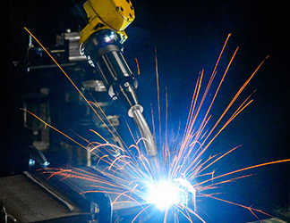 Image of robotic welding with sparks