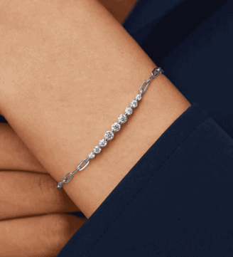 GLAMAVERA Kessane Bar Bracelet in 925 sterling silver worn on the wrist with a navy sleeve