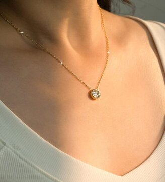 Torvane yellow gold moissanite bubble necklace worn by a woman