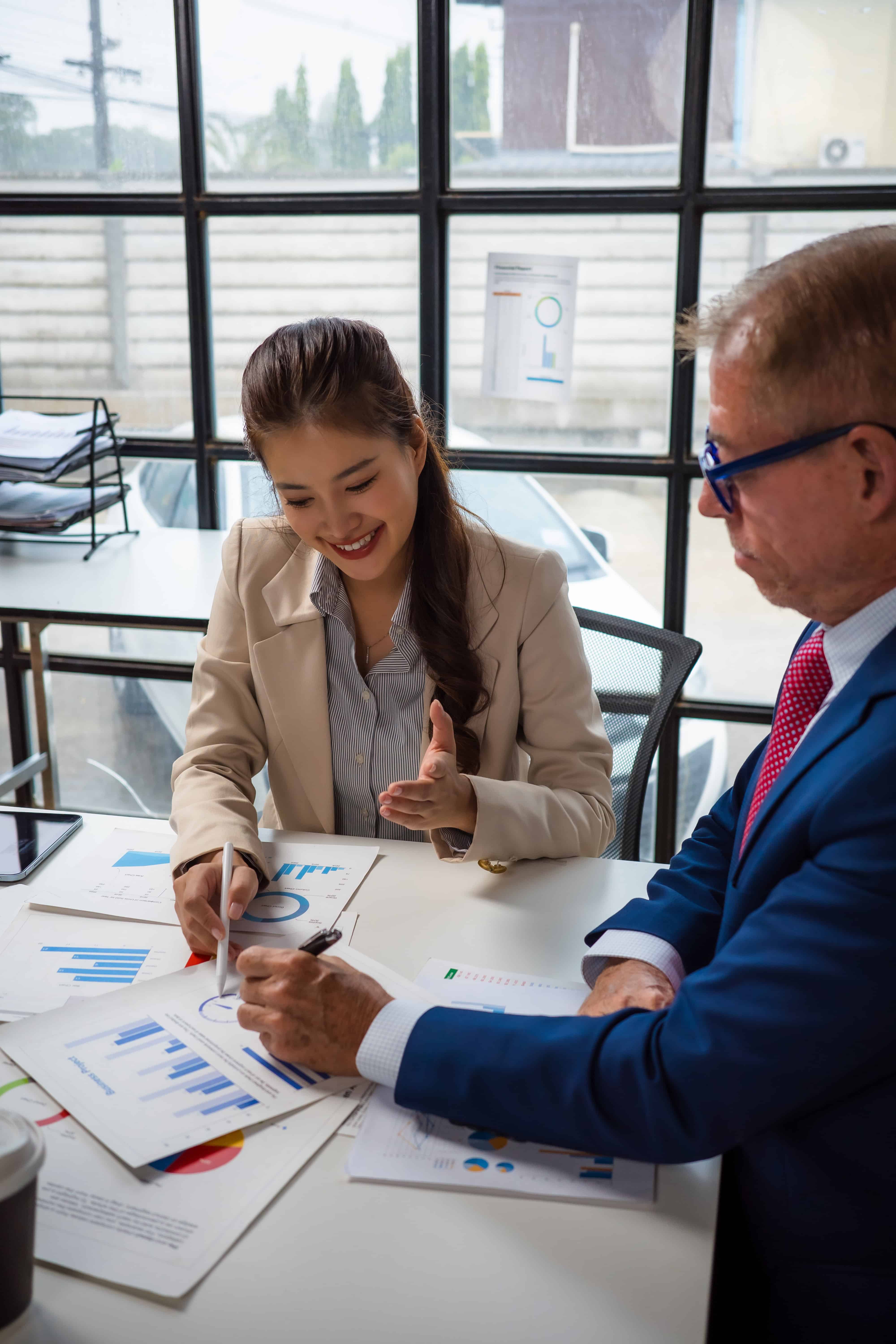Business professionals analyzing private equity data in a modern office.