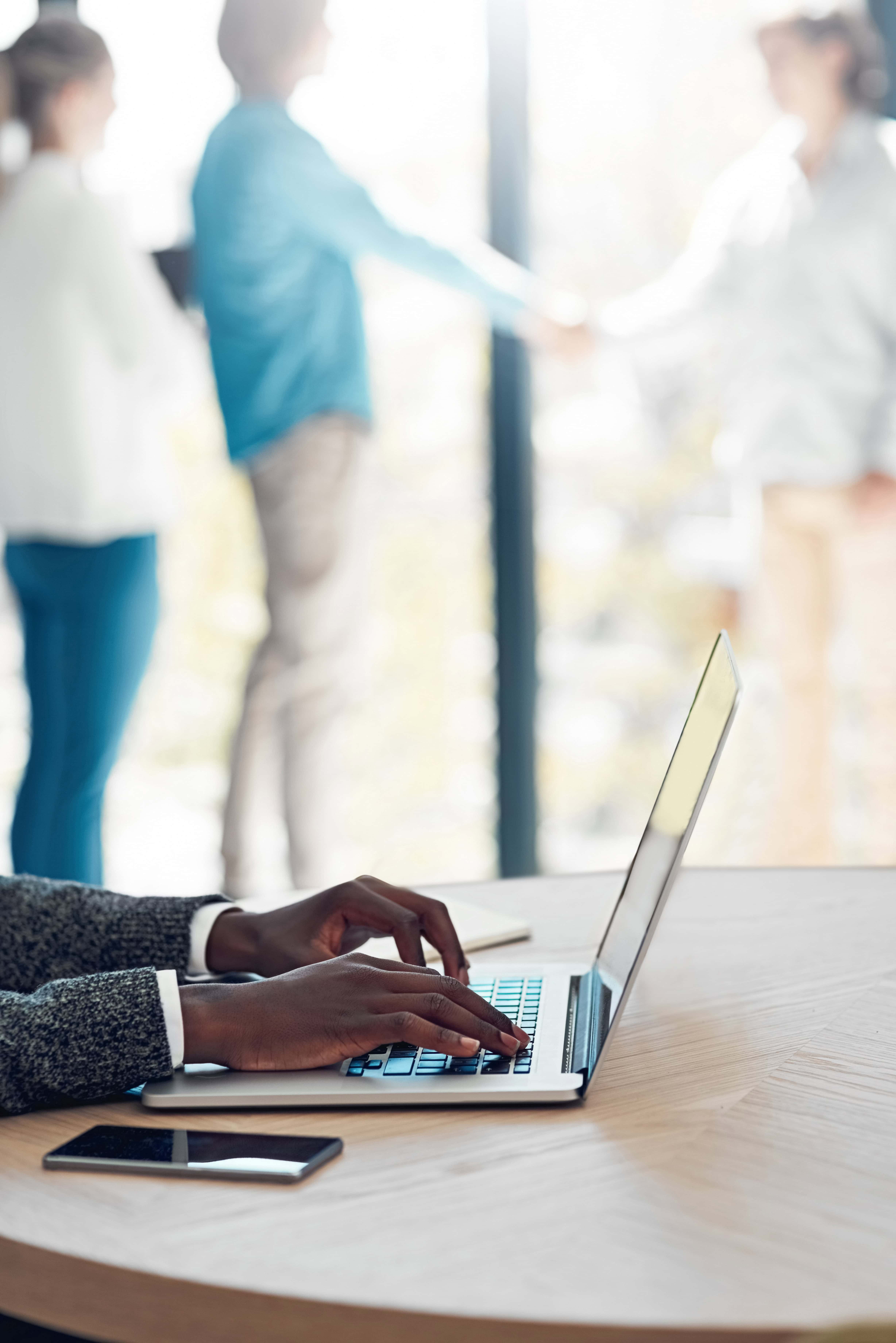 ESG and legal reports analysis with team collaboration in a modern office setting.