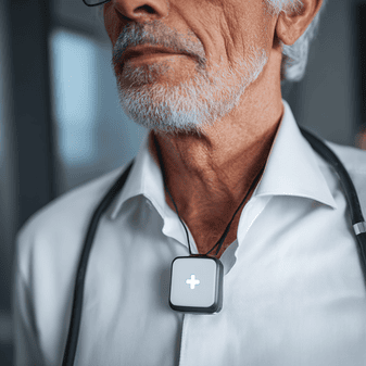 senior male with wearable medical alert button