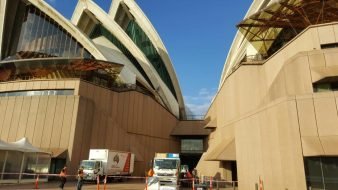 Removalists loading furniture into moving truck
