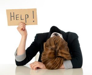 Faith-Based Online Christian Counselor - Women Holding up a "Help" Sign