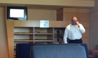 Some salesman talking on phone in a quiet zone