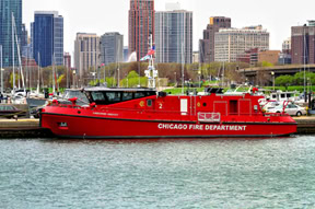 Image of a boat going down a river in front of a skyline