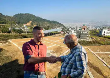Informal property broker showing a land plot to prospective buyers in Kathmandu Nepal