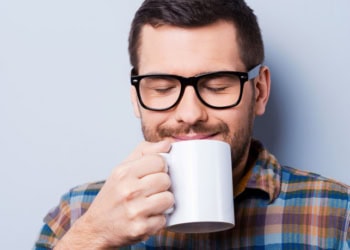 Coffee can help people have a more favorable view of their colleagues, according to new research