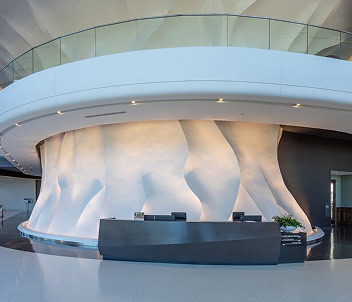 A striking modern sculpture anchors the lower mezzanine of 1000 Social, a luxury office, retail, and event space for lease in Midtown Raleigh