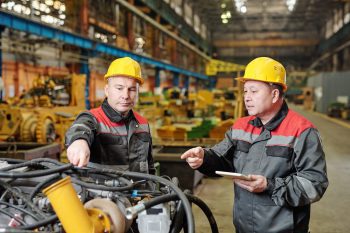 Two Maintenance Men discusiong Maintenance Repairs and eWorkOrders CMMS.