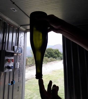 Checking for lees at the Burbujas de Altura winery in Cafayate