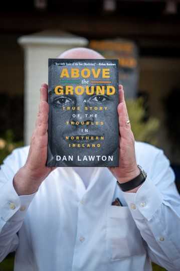 Dan Lawton with the Book Cover of ABOVE THE GROUND at an Orange County Book signing 9/13/2025