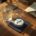 Editorial flat-lay of a desk with a ZYN nicotine pouch tin