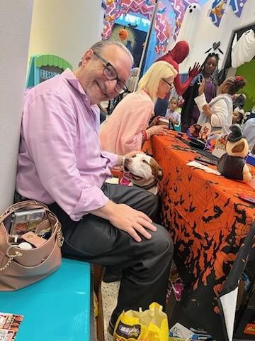 Adam Miller interacting with families at Houston children’s museum Halloween event