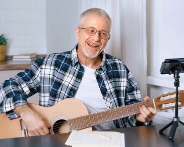 Tom after learning guitar (s)