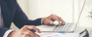 person calculating if they can replace salary fast with a franchise