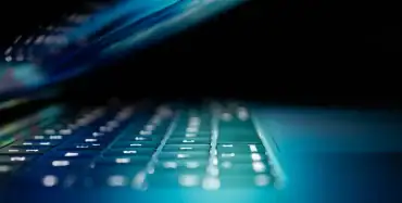 Laptop with illuminated keyboard — electronic signing of cross-border contracts in Ukraine