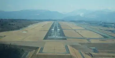 Aerial view of an airport runway framed by mountains — legal checklist for investing in Ukrainian airport infrastructure