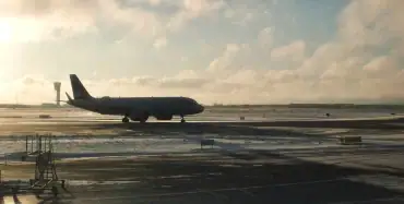 Single aircraft on an empty snow-covered apron at sunrise — Ukraine airports reconstruction and the adopted aviation strategy to 2030