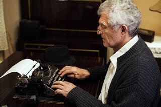 Typing at typewriter small