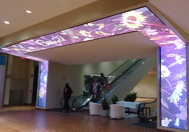 InFiCOB P1.56 indoor COB LED display with floral ceiling design in shopping mall atrium in Qatar