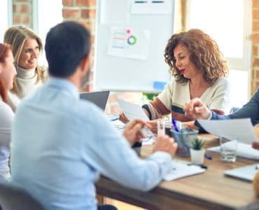 in-person meeting of a franchise leadership team