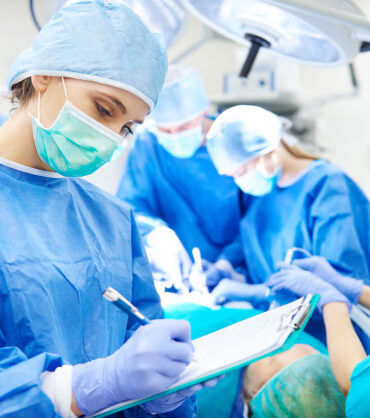surgeon-writing-down-some-operation-notes