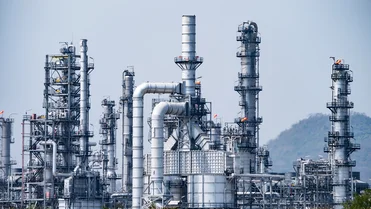 Chemical plant with storage tanks and pipelines representing industrial chemical production and supply