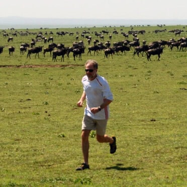Dan Leiberman running in the Serengeti.
