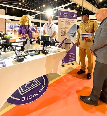 DRONICLE CEO and COO explaining to an UAE army representative the Swiss technology of drone cleaning