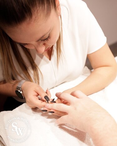 A close up of the manicure