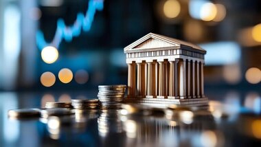 makieta banku, monety, w tle wskaźniki