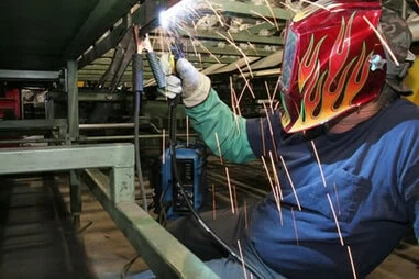 Image of person welding in a GMAW application