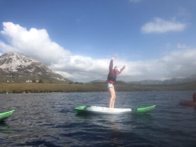 A young man kayaking in Dunlewey Lake