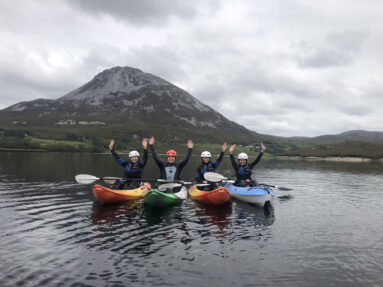 Group kayaking in Dunlewey Lake