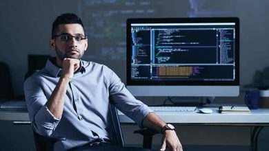 software developer sitting near a PC screen