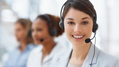 smiling woman wearing headphones with microphone