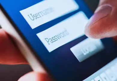 Guy typing his social media username and password login.