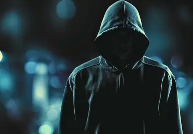 Man wearing black hoodie.