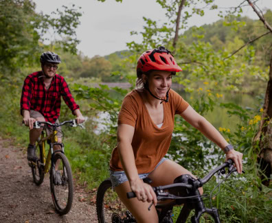 Couple Mountain Biking on the Black Bass Trail