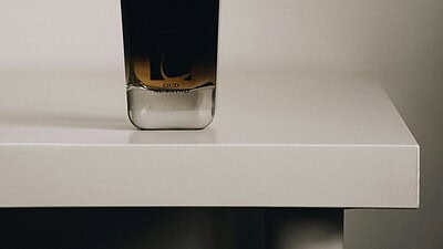 cologne bottle on shelf