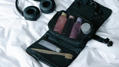Black headphones and pouch with accessories