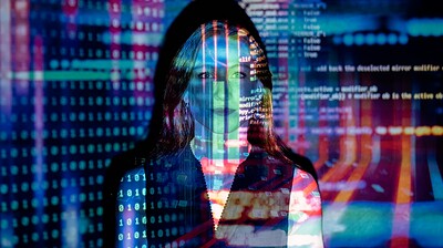 code projected over woman