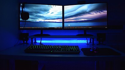 two computer flat screen monitors turned on